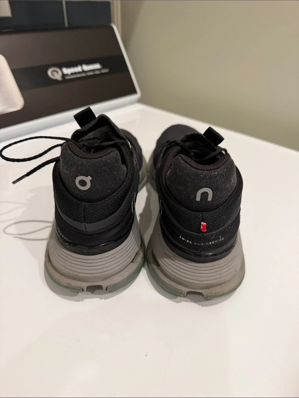 On Running woman’s Black Athletic Shoes with Lime and Pink Accents